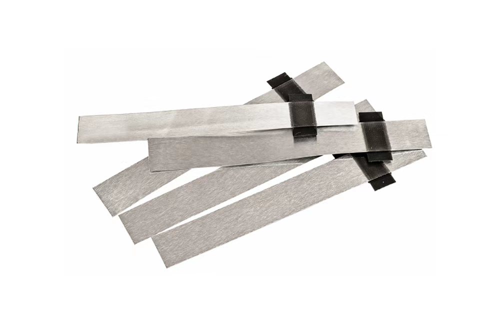 Xnergy positive electrode aluminum tabs for battery cell assembly
